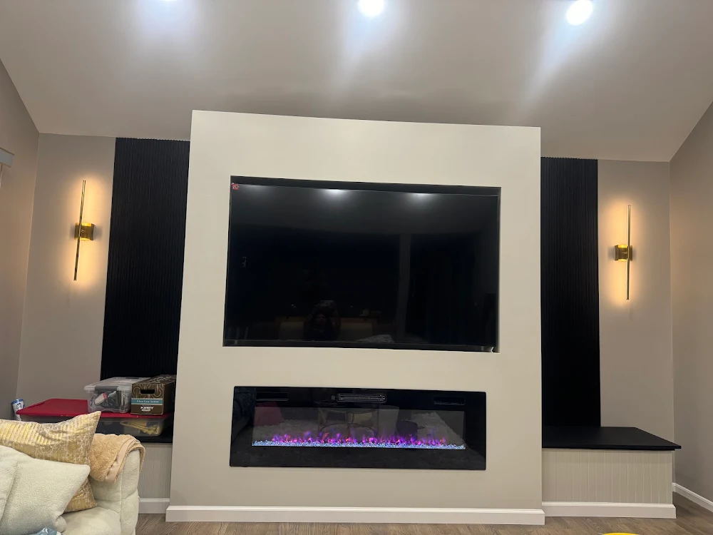 Recessed television and electric-fireplace media wall completed by RDF in Blauvelt