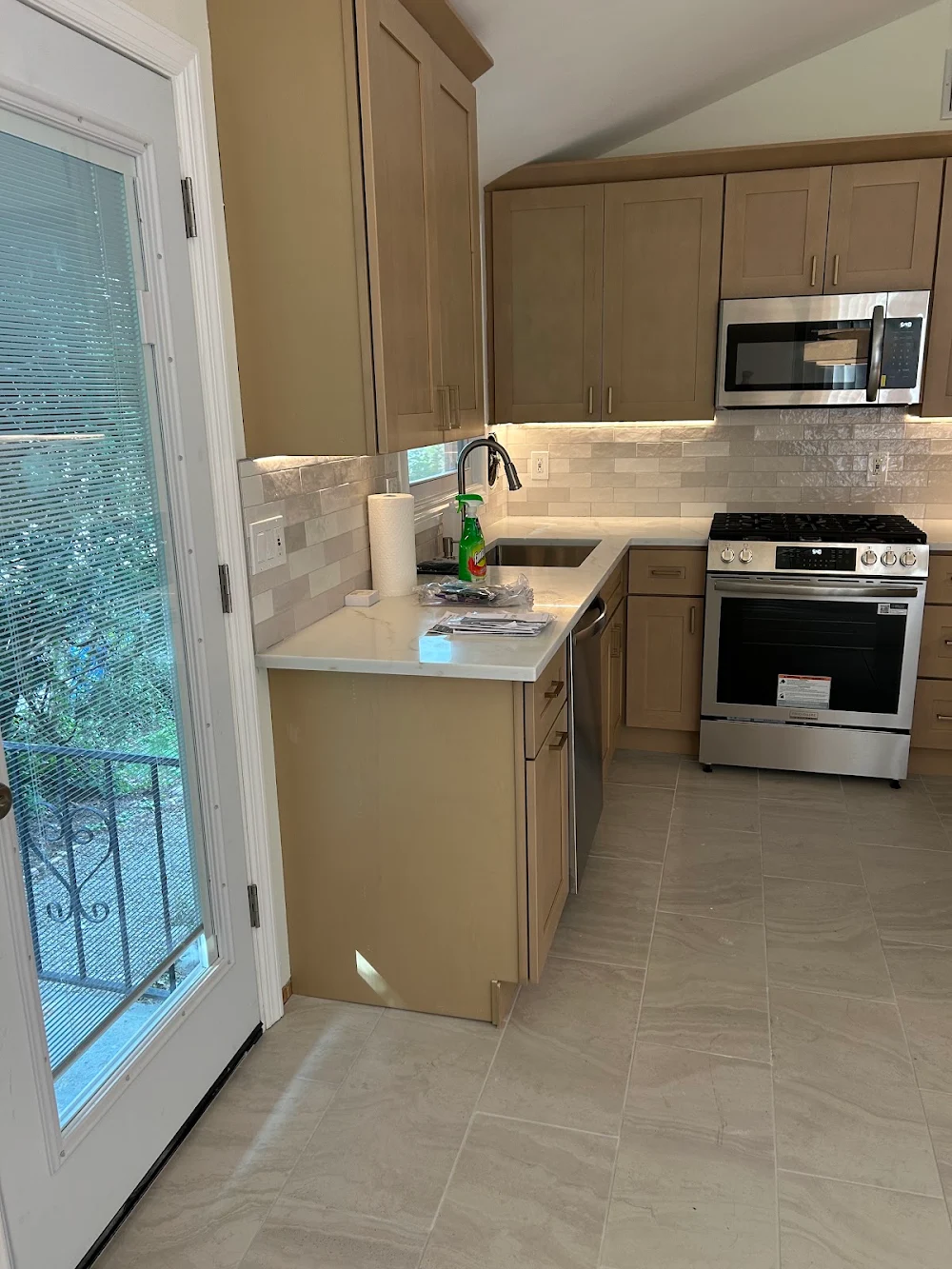 Completed shaker kitchen remodel in New City, NY with light wood cabinets