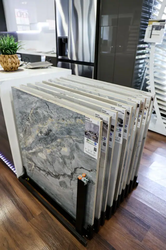 Stone slab samples stored vertically in a display rack