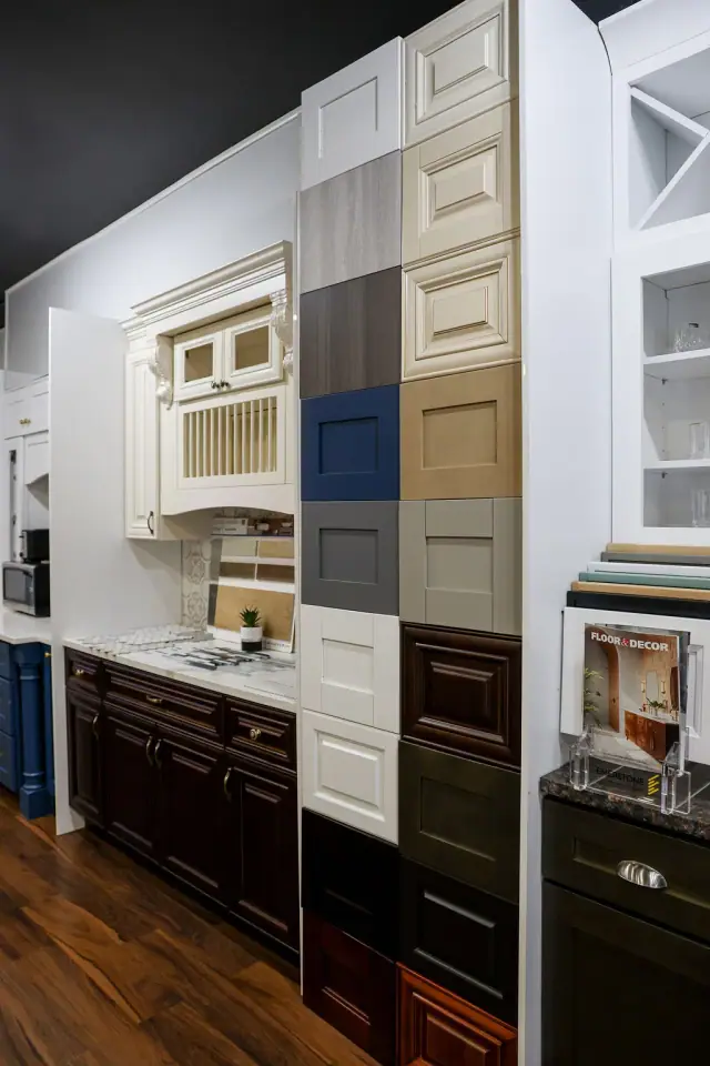 White and dark cabinetry with stacked finish samples