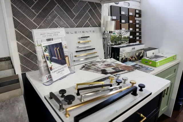 Tile, hardware, and finish samples on a presentation table