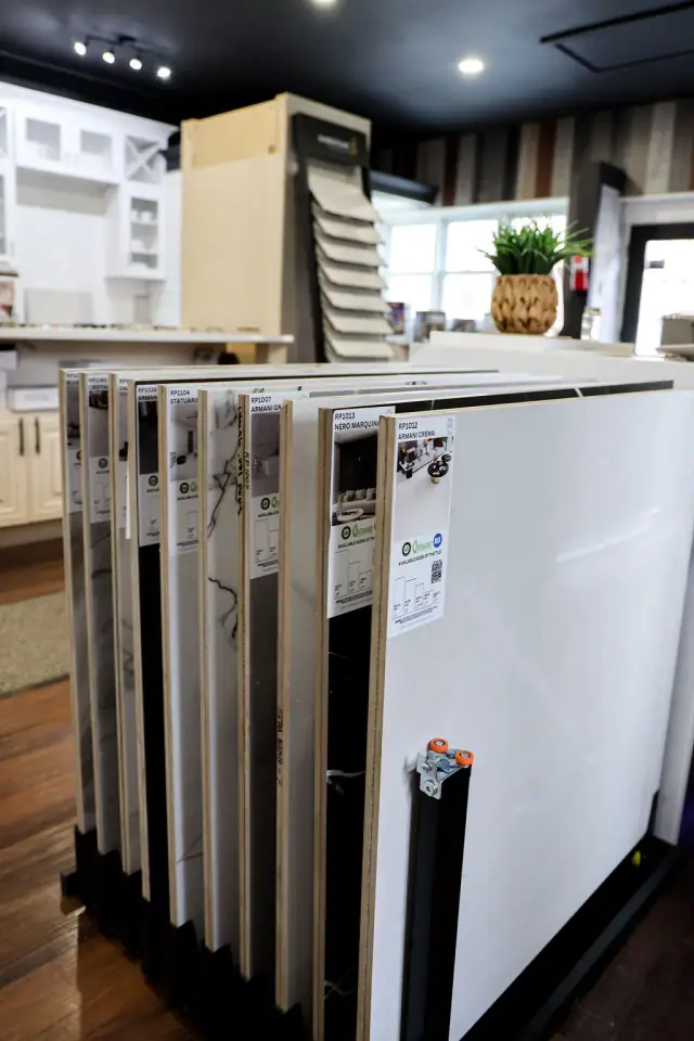 Tall cabinet and door samples beside a showroom island