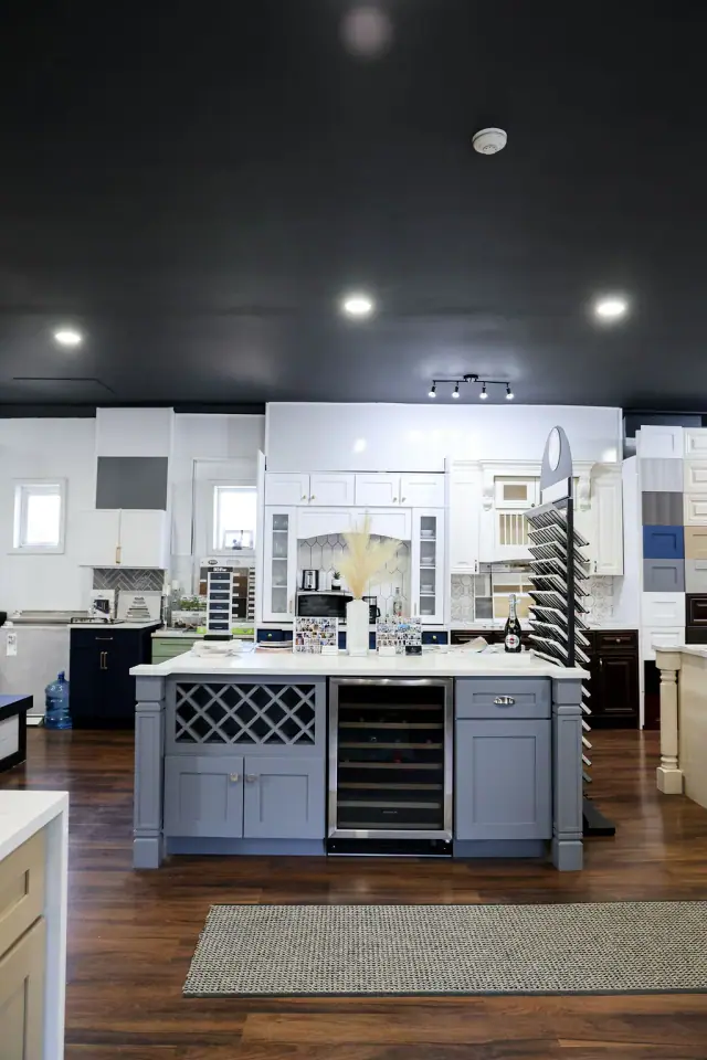 Front view of white island and cabinet wall displays