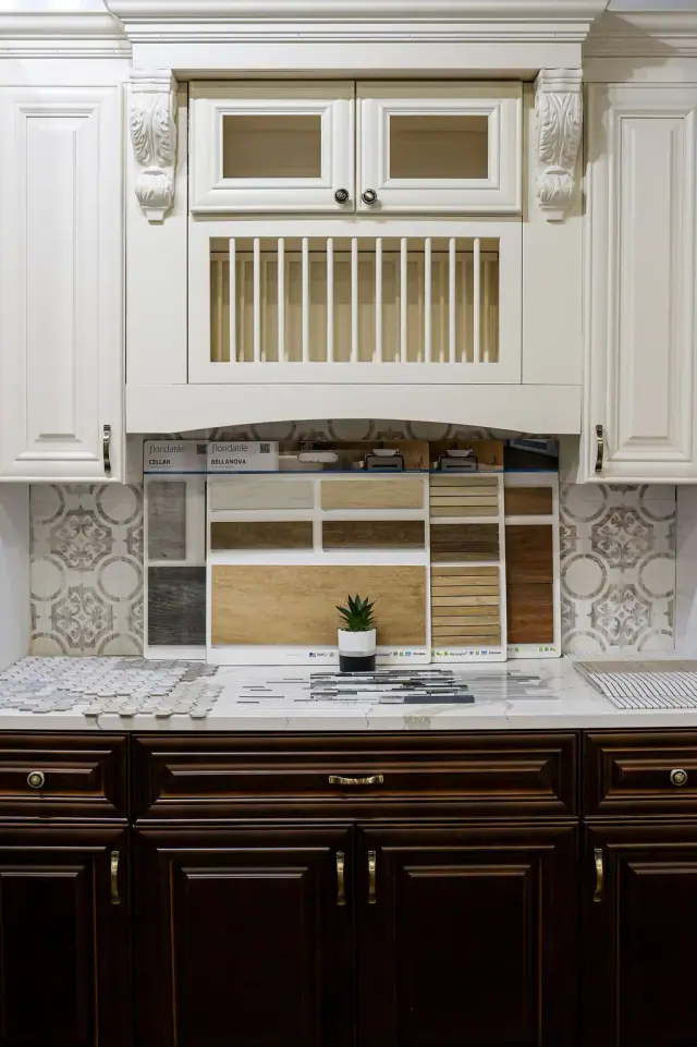 White hutch with open shelves above dark base cabinets
