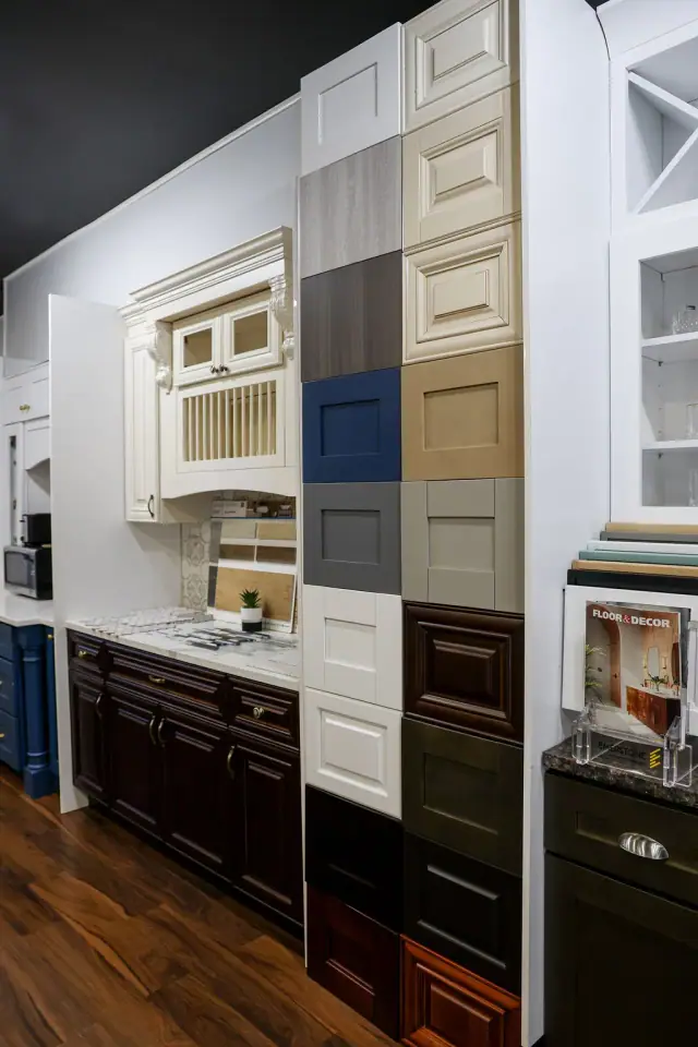 Dark and white cabinet display with stacked sample boards