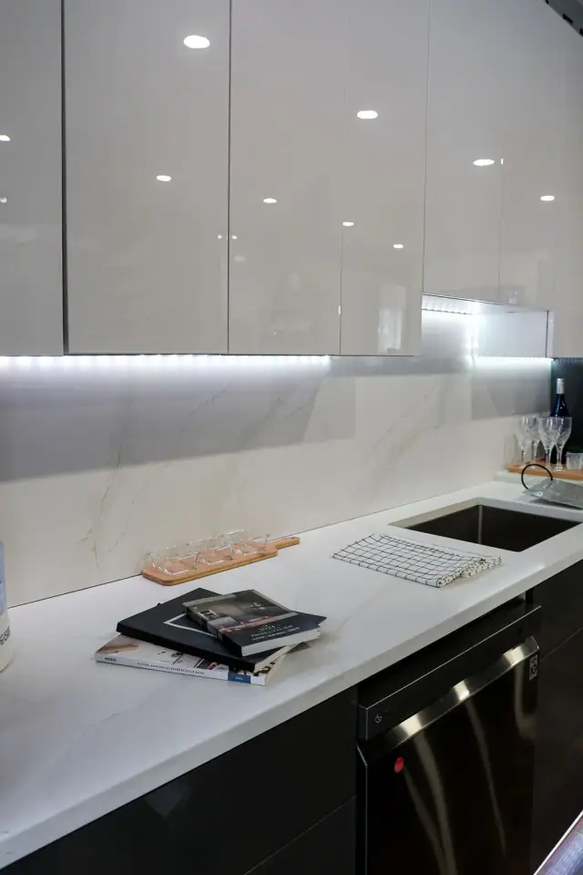 Illuminated gray sink display viewed from the side