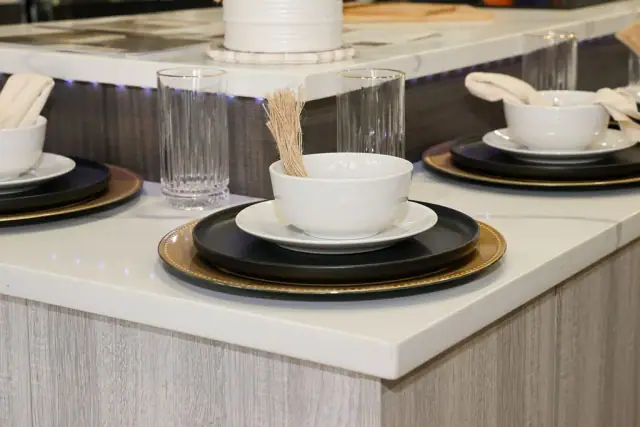 Layered table setting on a light countertop display