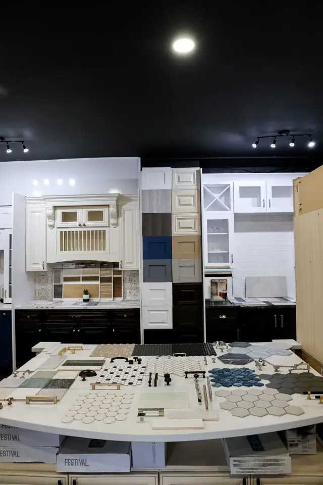White cabinet wall and dark countertop material display