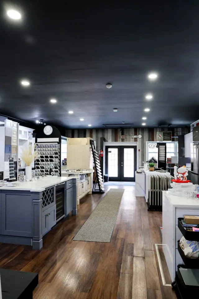 Showroom aisle with blue-gray island in the foreground