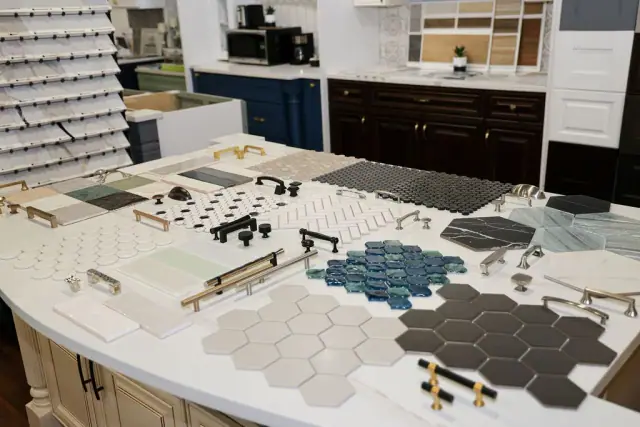 Geometric tile and hardware samples arranged by color