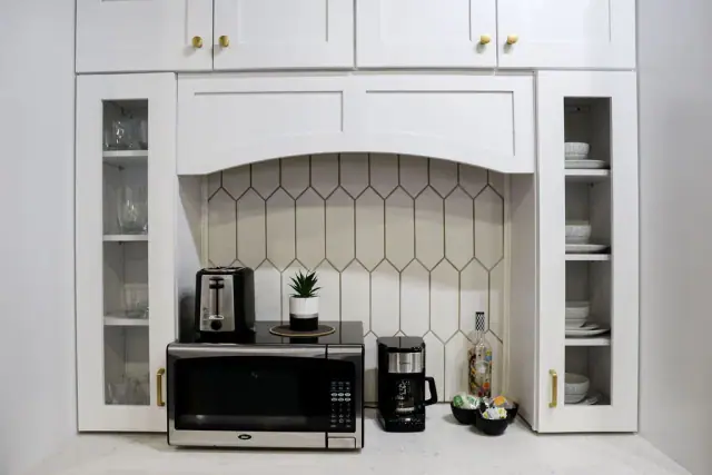White display hutch framing a dark appliance niche