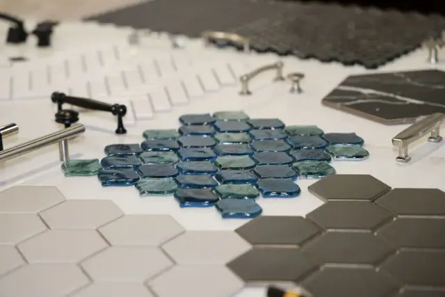 Blue and gray geometric tile samples with black fixtures