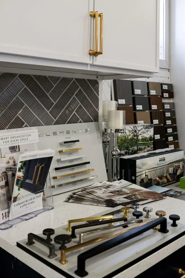 Hardware and finish boards propped against backsplash samples