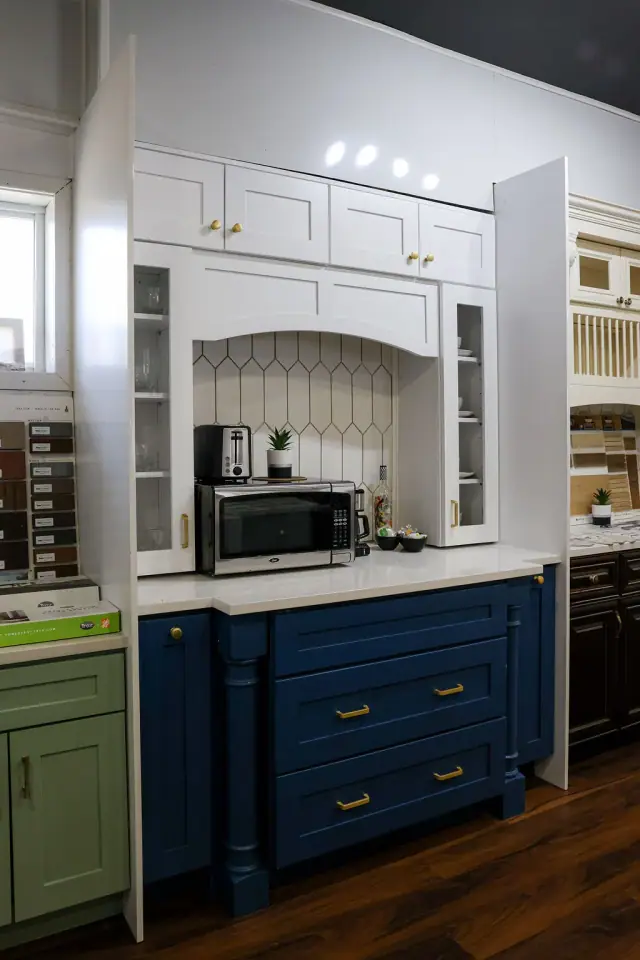 Blue base cabinet display with white upper shelving