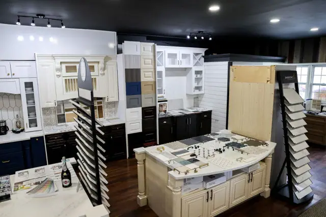 Wide showroom view with material racks and central island
