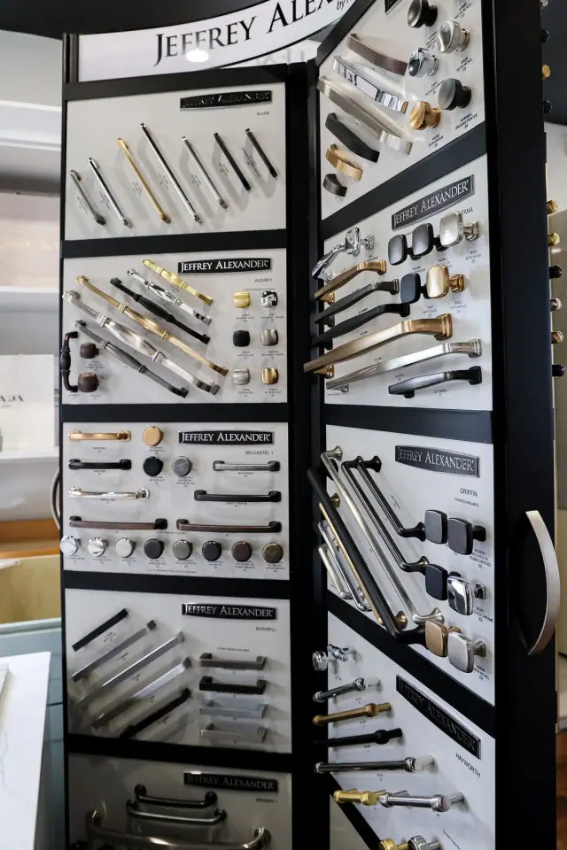 Tall rotating rack filled with cabinet hardware sample boards