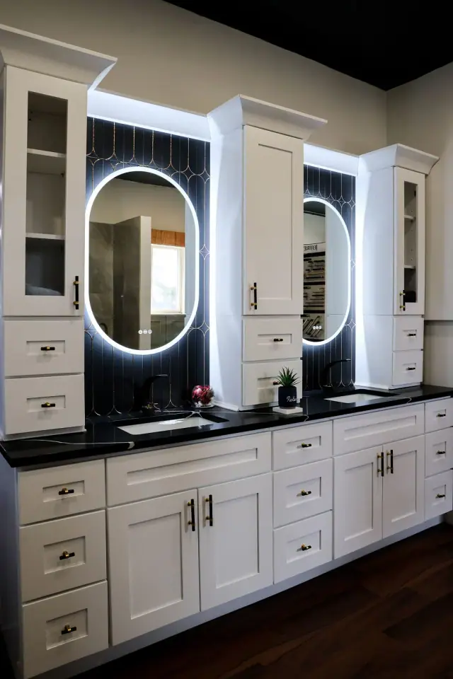 Double vanity display with two illuminated oval mirrors