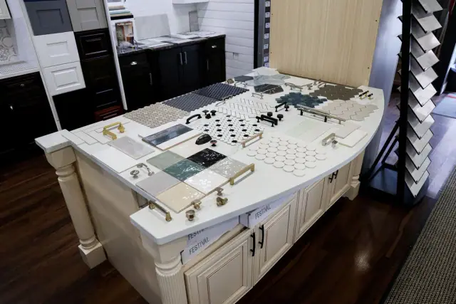 Large planning table covered with hardware and material samples