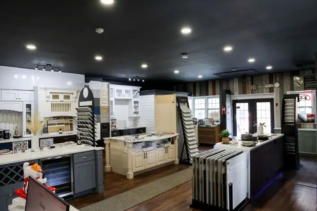 Wide showroom view with multiple lit cabinet installations