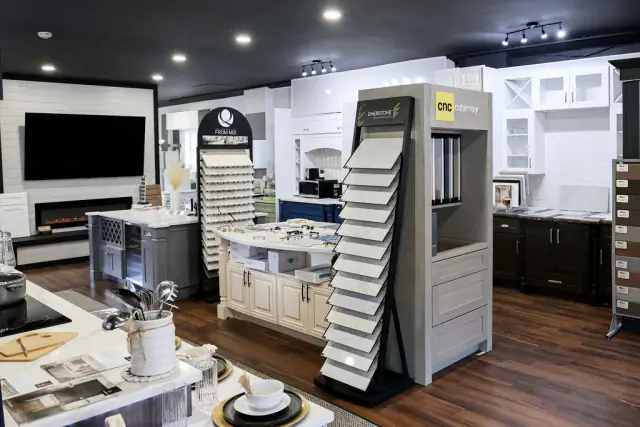 White kitchen display beside freestanding sample towers