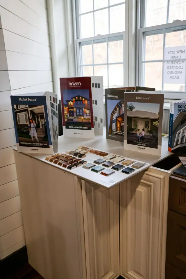 Wood cabinet sample station beneath a bank of windows