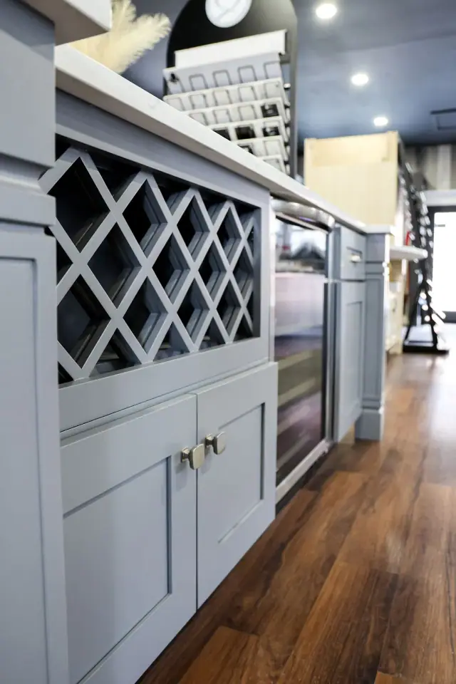 Blue-gray wine storage cabinet with decorative lattice
