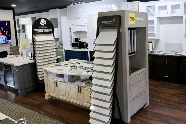 Wide showroom display with cabinet doors and sample towers