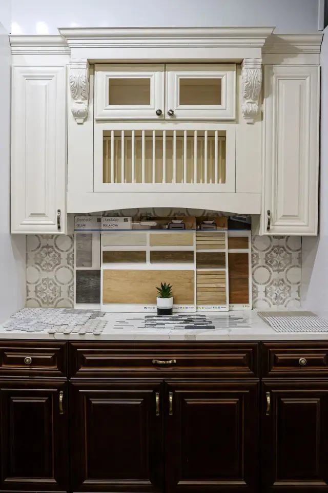 White hutch above dark cabinetry and tiled backsplash