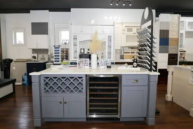 Front view of white island with lattice panel and drawer bank