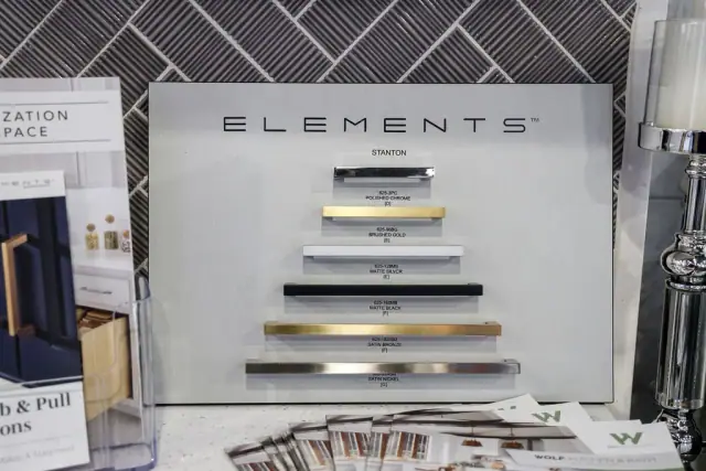 Element wall display with rows of cabinet pulls