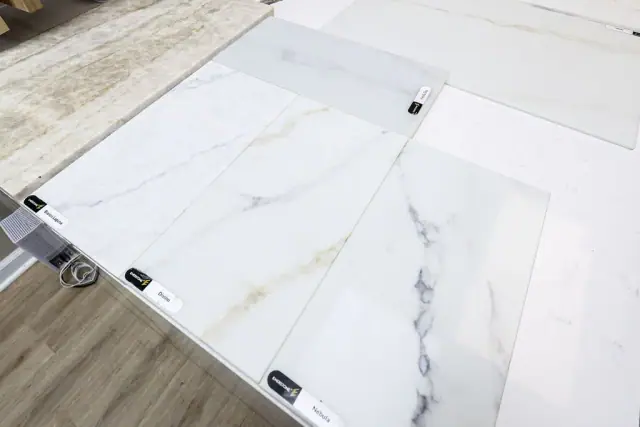 White marble-look slab sample with dark veining