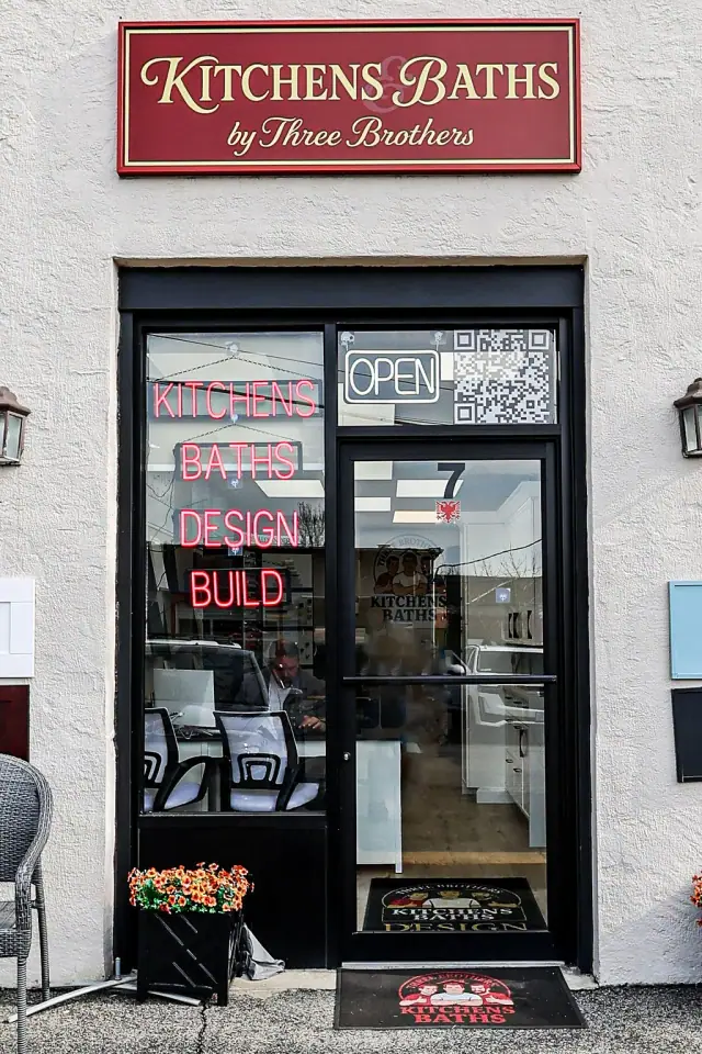 Black-framed showroom door with product signs