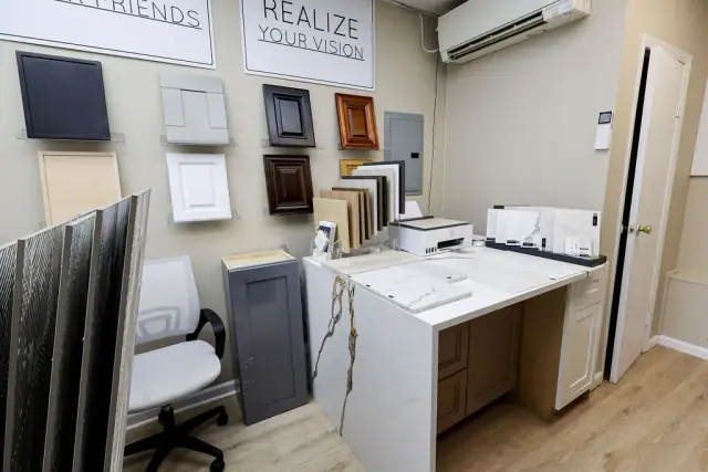 Showroom worktable surrounded by cabinet and surface samples