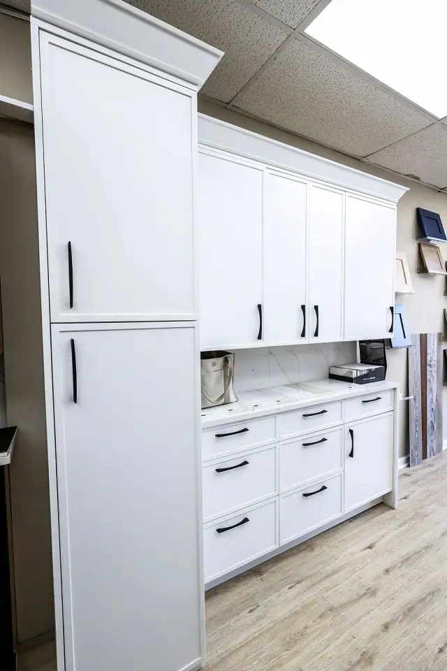 White drawer cabinet beside upright material samples