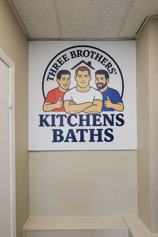 Kitchen and bath showroom sign above a sample rack