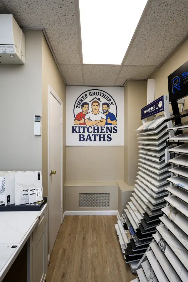 Tall finish sample rack beneath kitchen and bath signage